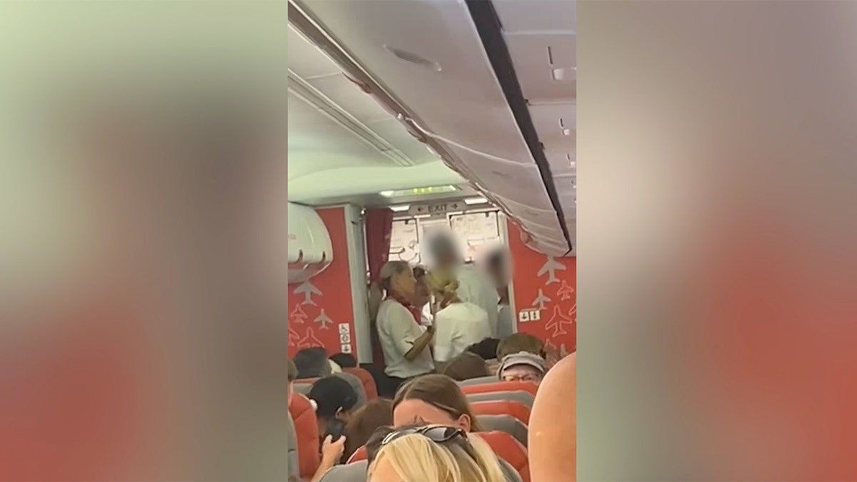 Two men have been banned from flying on a British airline after police removed them from a plane for behaving inappropriately while they were allegedly intoxicated.
