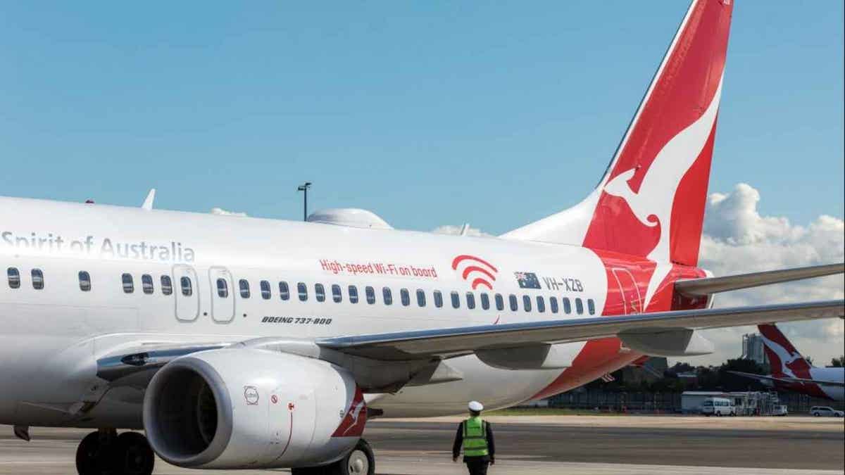 Qantas aircraft at a gate at an airport.