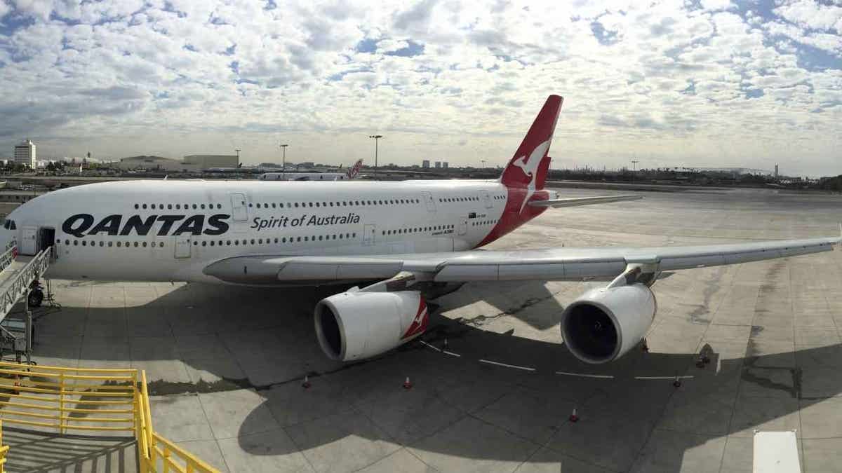 Qantas aircraft at a gate at the airport.