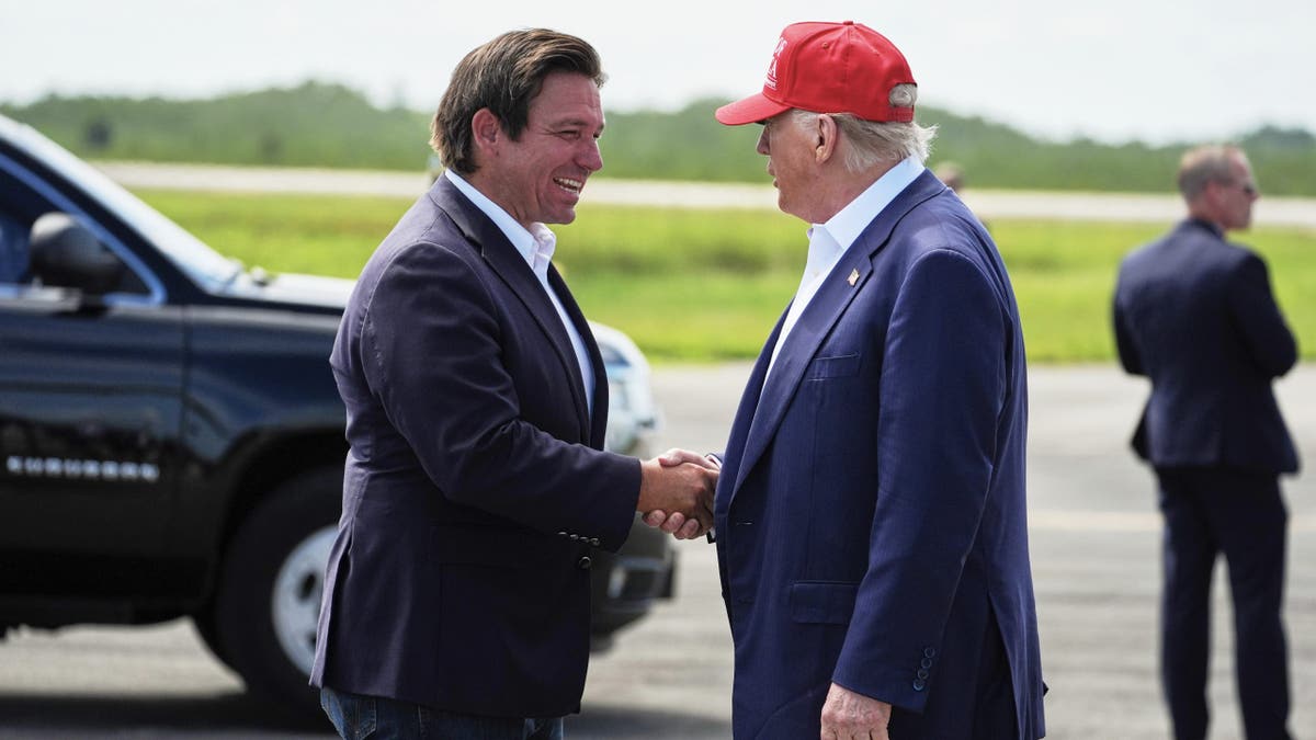 DeSantis and Trump shake hands