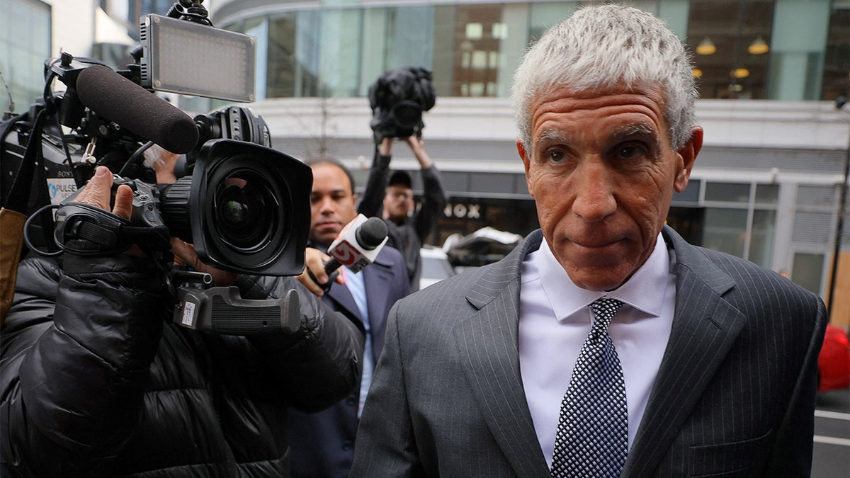 Rick Singer arrives at court