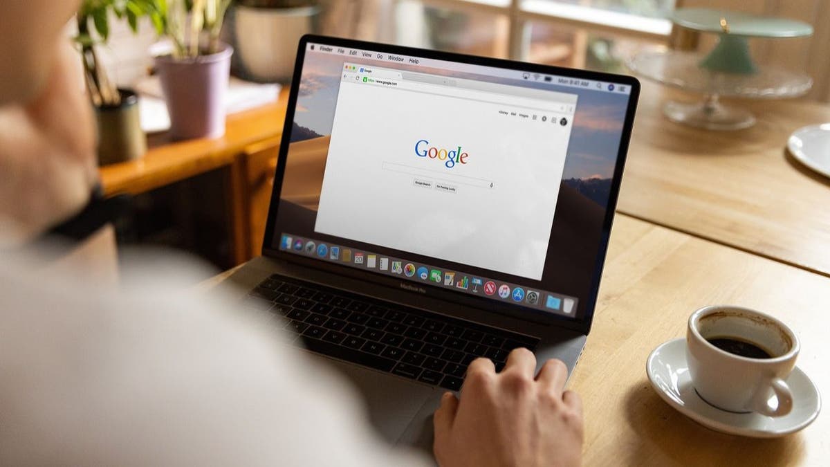 A person surfing on their laptop.