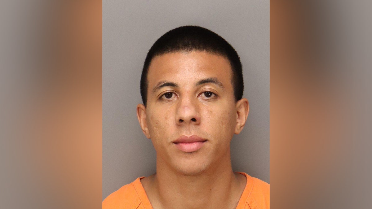 Mugshot of Taj Malik Taylor in orange jumpsuit.