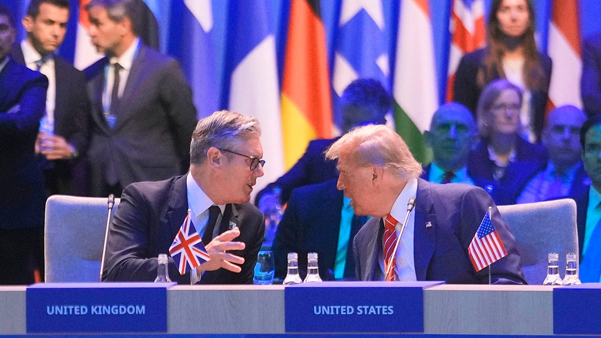 President Donald Trump speaks to Britain's Prime Minister Keir Starmer during a NATO summit at the Hague.