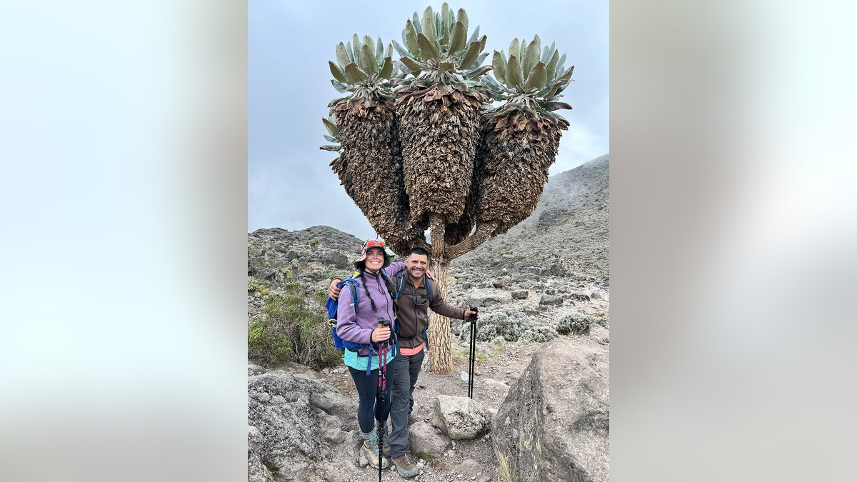 Lindsay Gutierrez and her husband climbing a mountain.