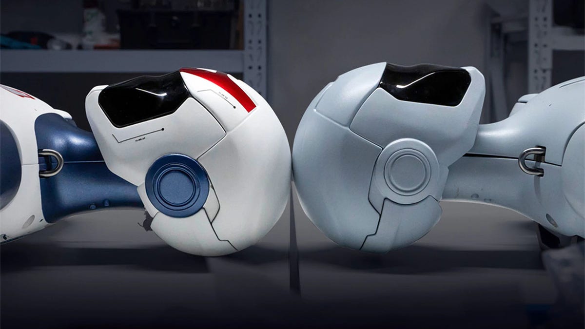Two R1 humanoid robots.