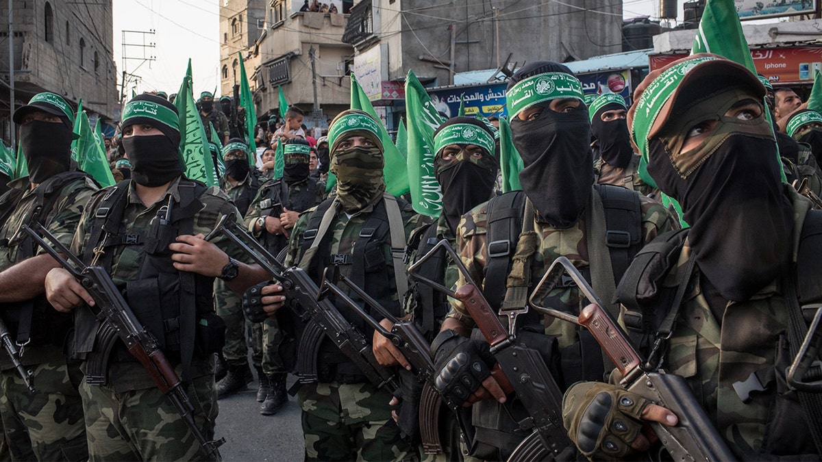 Hamas terrorists marching in Gaza during a parade.