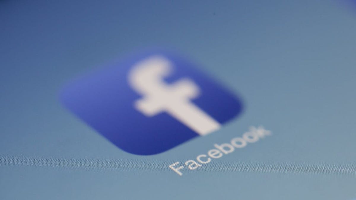 A Facebook app on the home screen of a smart phone.