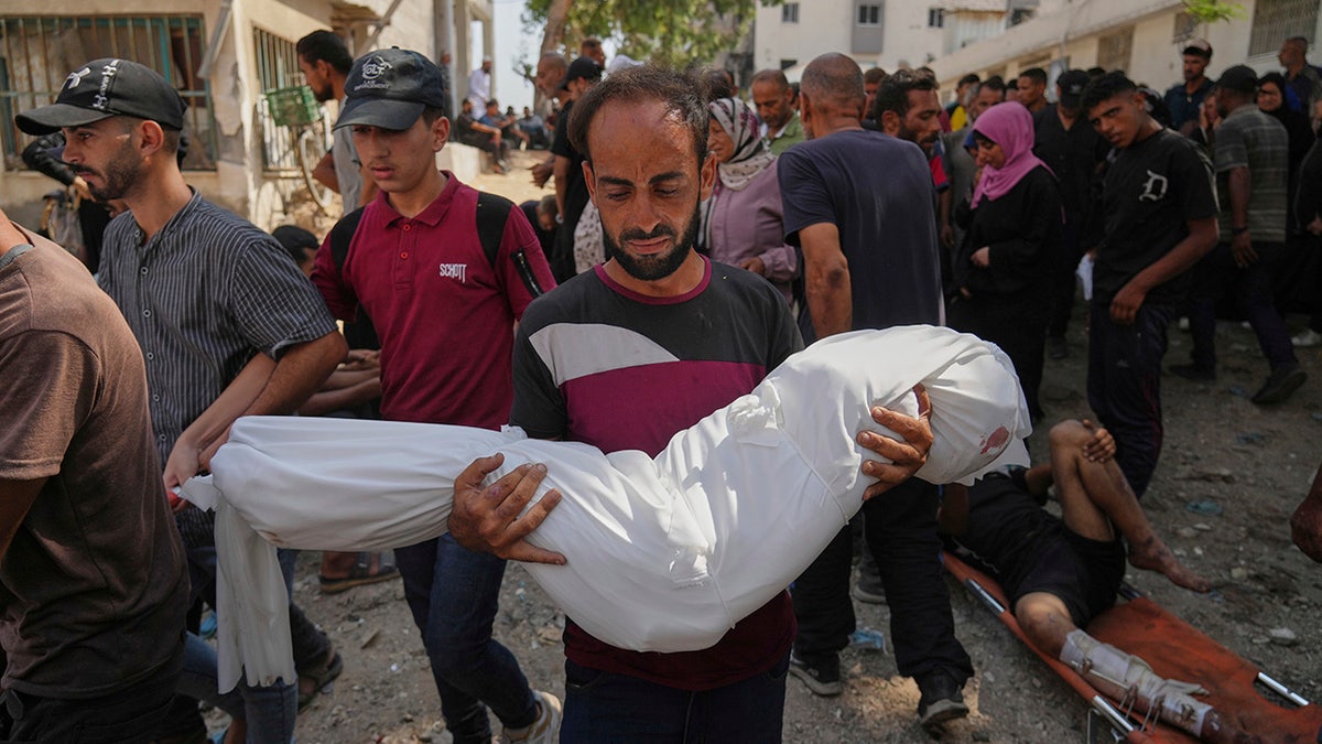 Palestinian holding body of nephew