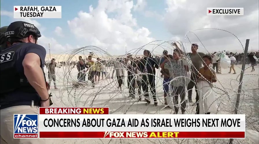 Desperate Gazans form 'human tidal wave' as they swarm aid site