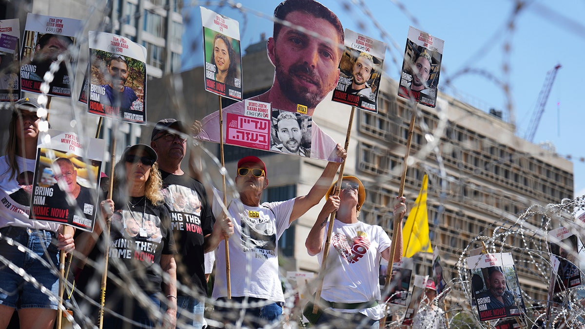 Families of hostages protest at the plaza known as the Hostages Square in Tel Aviv, Israel, Saturday, Aug. 2, 2025. 