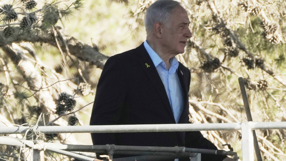 Israeli Prime Minister Benjamin Netanyahu stands on a platform overlooking the Gaza Strip during his first visit to Kibbutz Nir Oz since the Oct. 7, 2023 attack by Hamas terrorists where a significant number of this community were killed or captured, near the Israel-Gaza border in southern Israel, on Thursday, July 3, 2025.