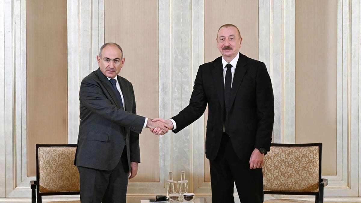 Leaders of Azerbaijan and Armenia shake hands