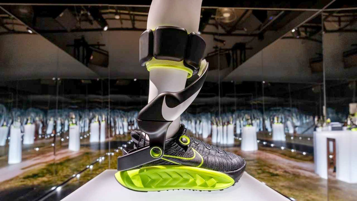 Nike’s Project Amplify neon shoe model on display.