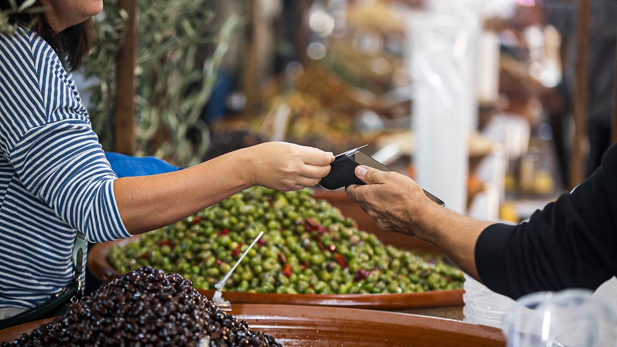 Woman tapping her card.