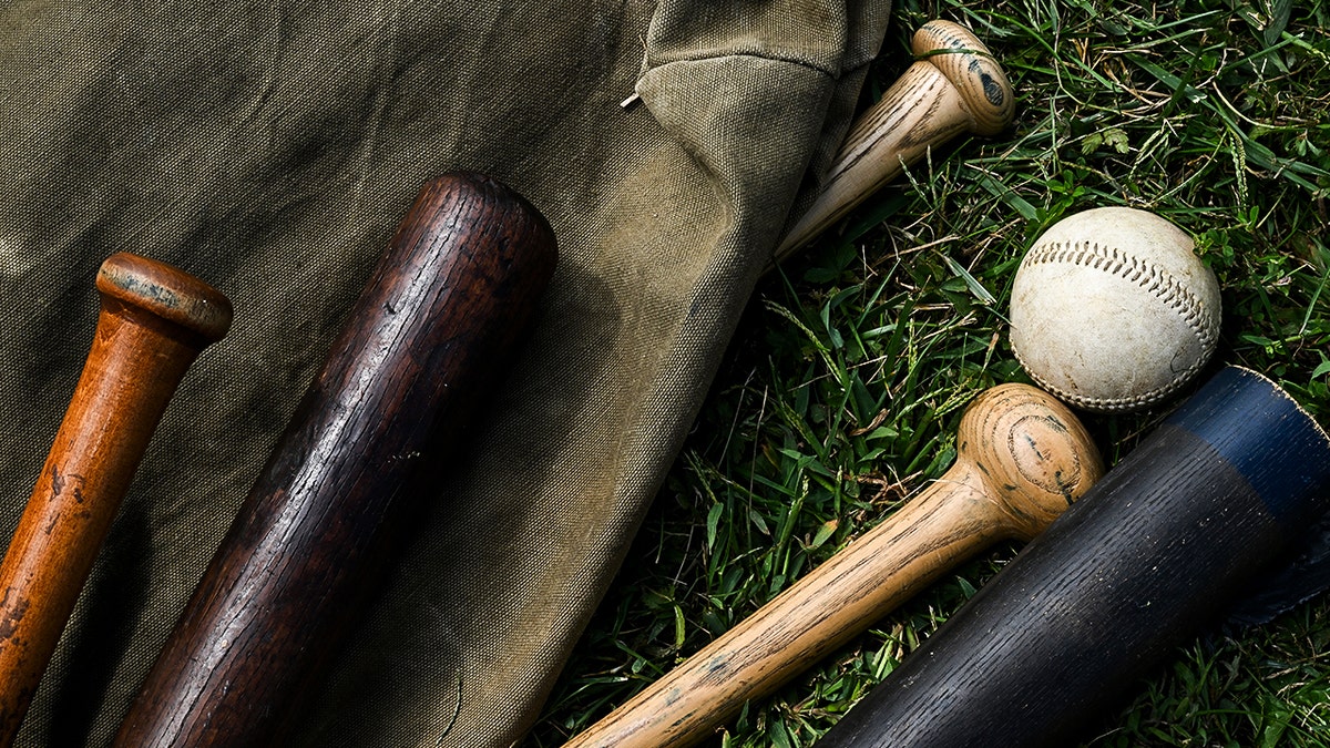 Baseball gear on the floor.