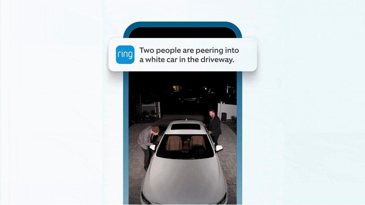 A Ring doorbell alert with two people getting out of a car
