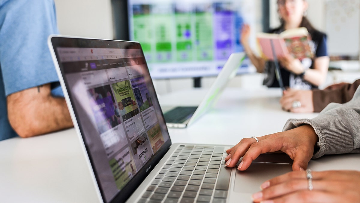 Woman typing on her laptop.