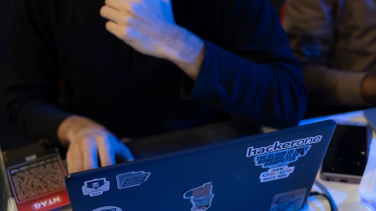 Hacker on his laptop.