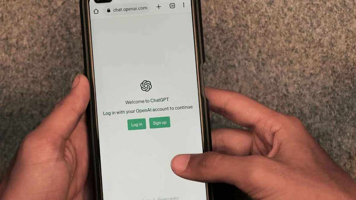 A teen using ChatGPT on his iPhone 