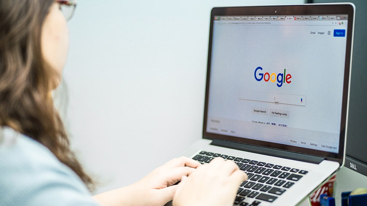 Woman using Google on her laptop.