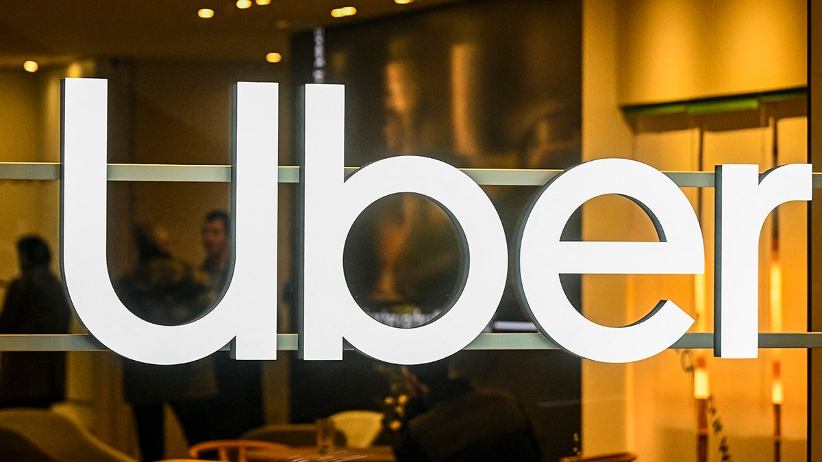 Photo of an Uber insignia.