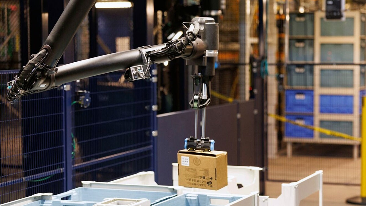 Amazon Blue Jay robot handling a package