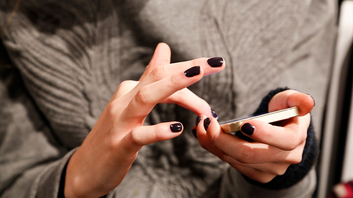 Woman using her phone.