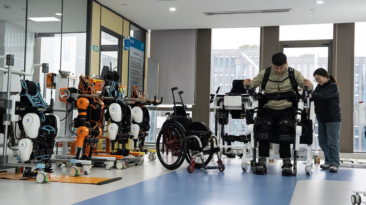Disabled man standing from his wheelchair using wearable tech.