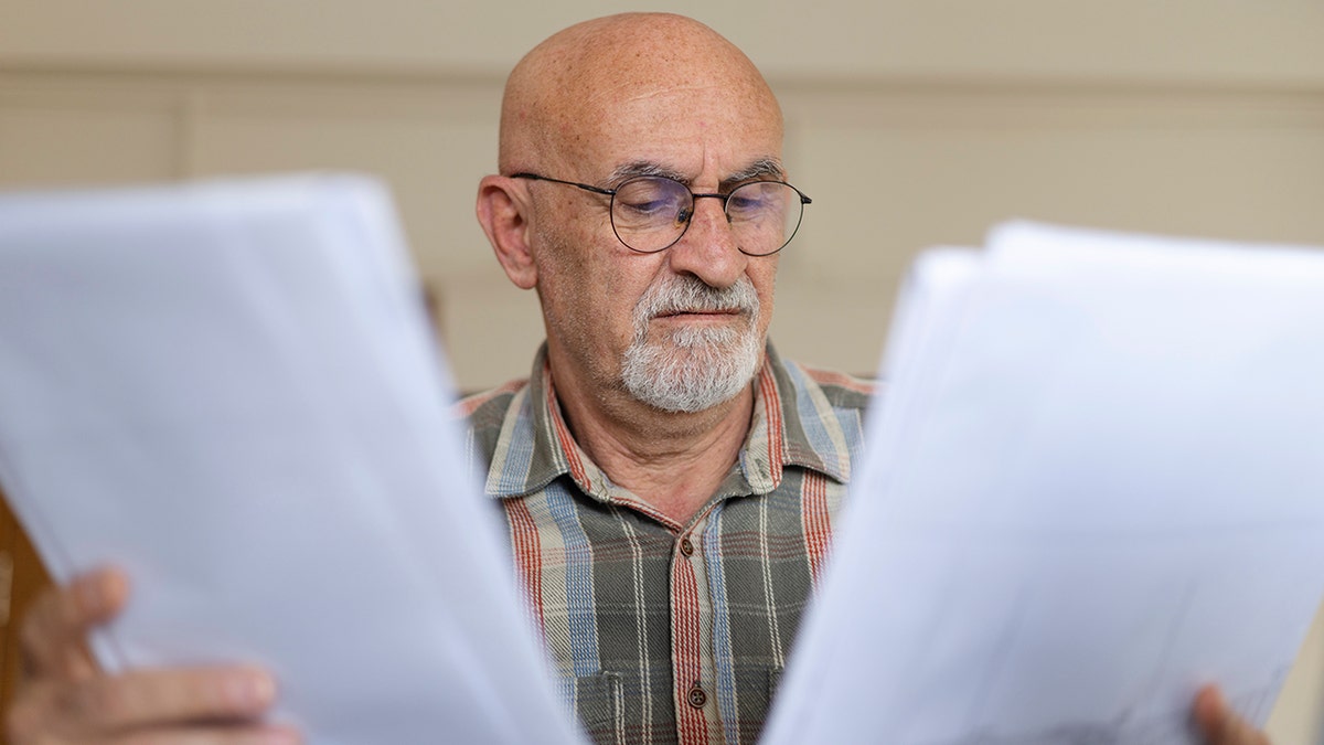 Man reviews inheritance documents